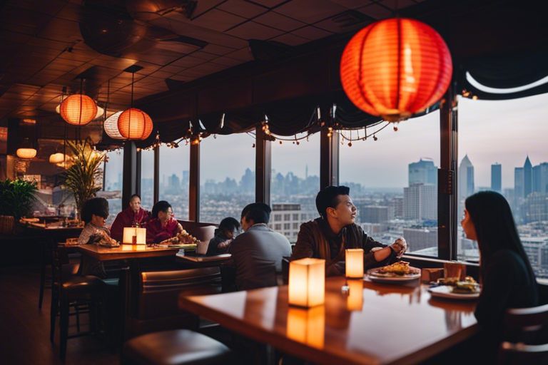 Diners enjoying a meal of pho in a restaurant with red lanterns and a city skyline view at dusk in Vietnam.